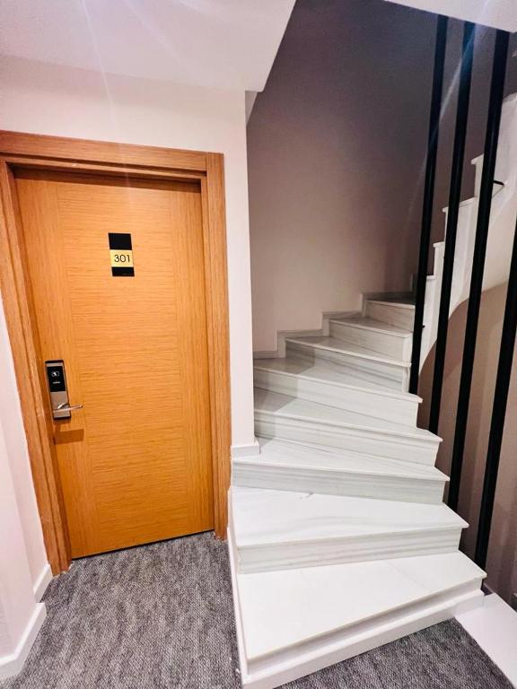 an office hallway with stairs and a door at ReeXe Istanbul in Istanbul