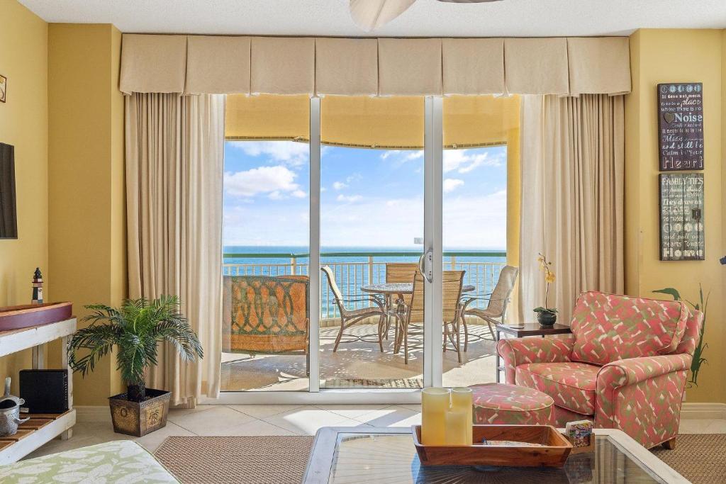 a living room with a view of the ocean at Beach Colony East 7C in Perdido Key