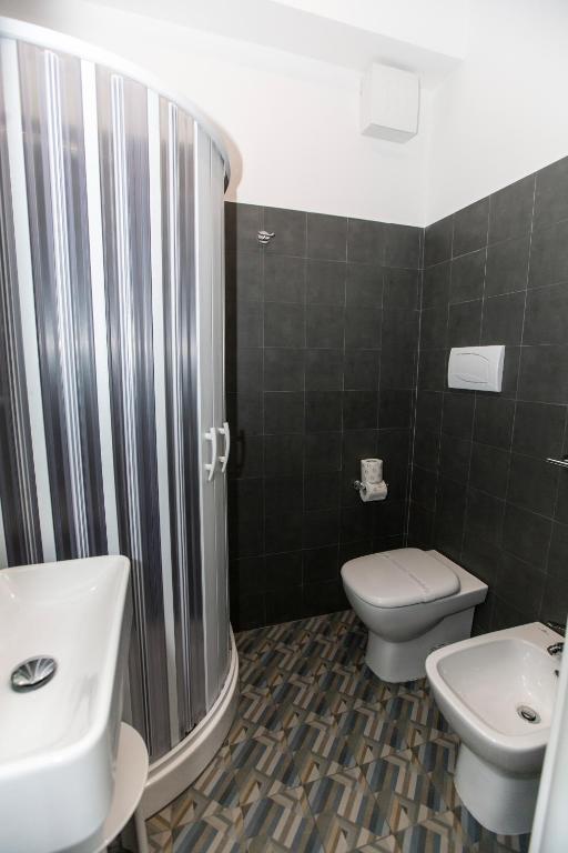 Koupelna v ubytování Malù Suites