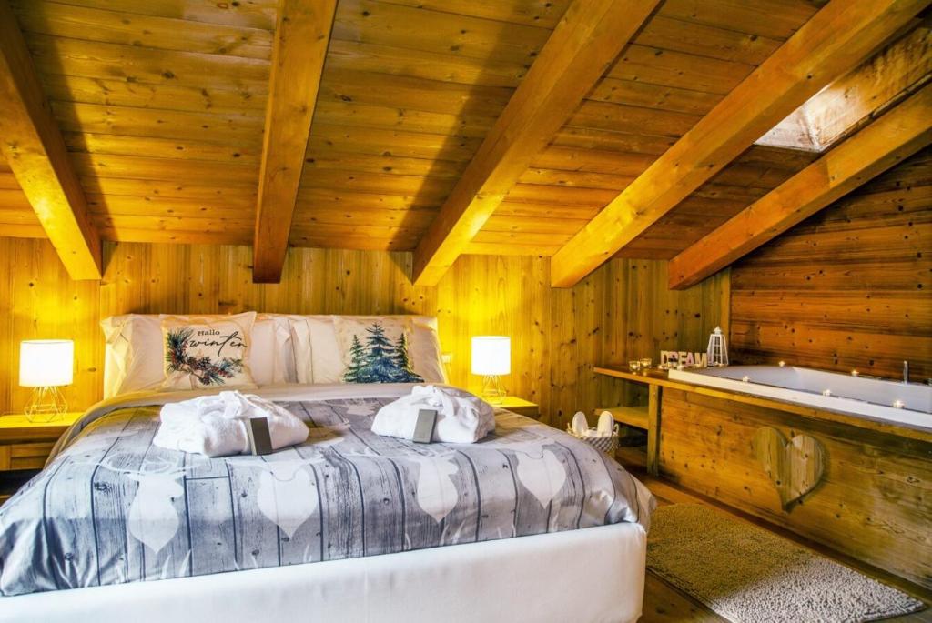 Postel nebo postele na pokoji v ubytování Bijoux Des Alpes - Mont Blanc Village