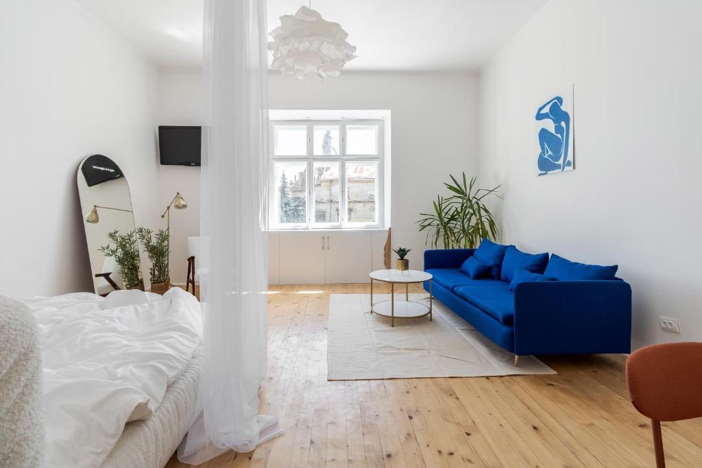 Ένα ή περισσότερα κρεβάτια σε δωμάτιο στο Є світло Апартаменти Прожиття