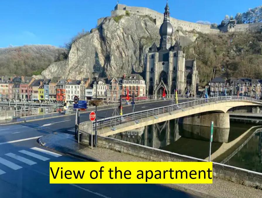 a view of a bridge over a river in a city at L'Essentiel in Dinant