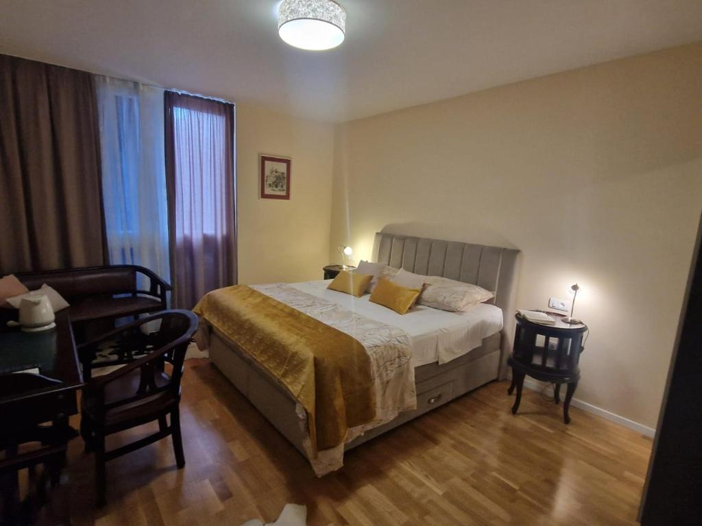 Postel nebo postele na pokoji v ubytování La-La Rooms