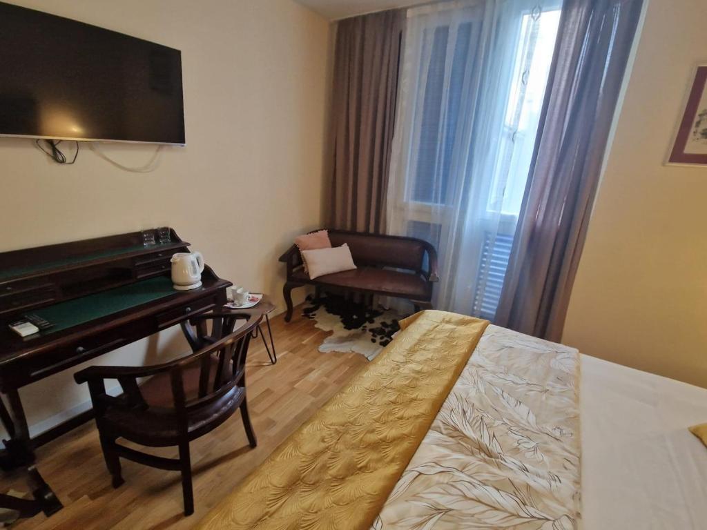 Postel nebo postele na pokoji v ubytování La-La Rooms
