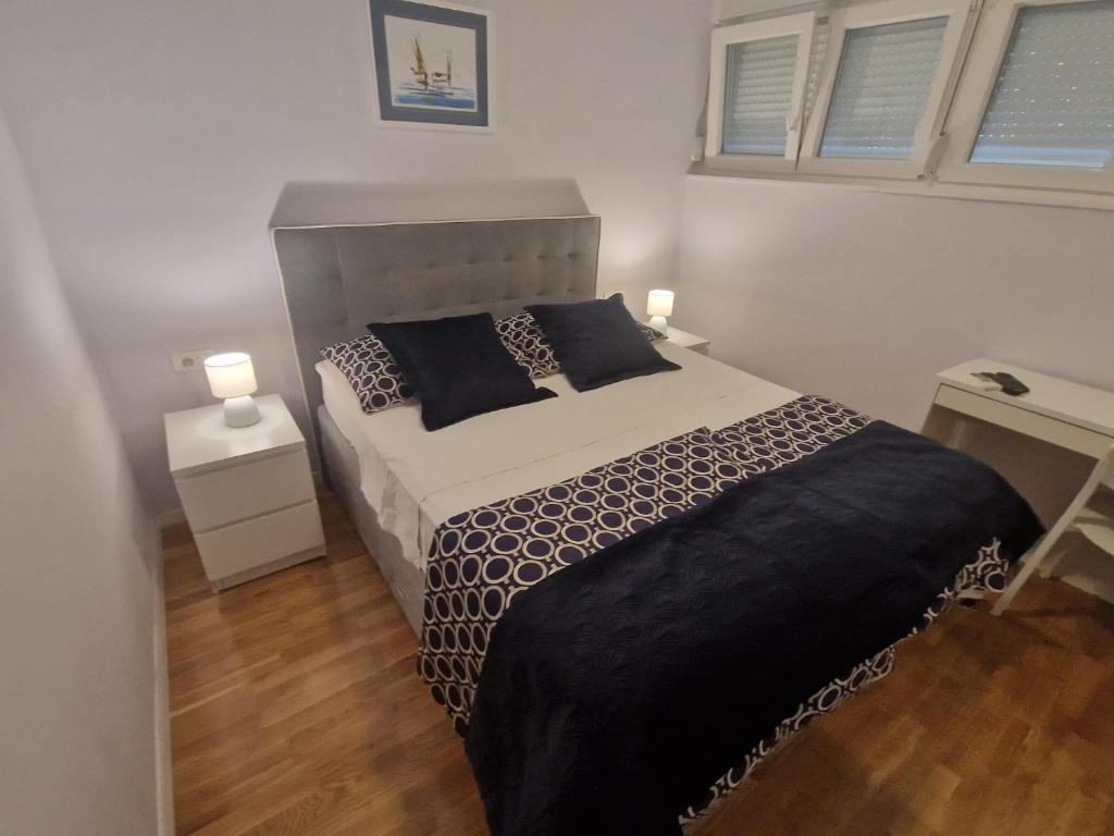 Postel nebo postele na pokoji v ubytování La-La Rooms