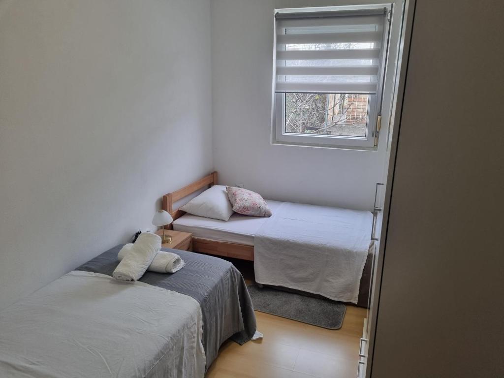 Posteľ alebo postele v izbe v ubytovaní Apartman Batarić