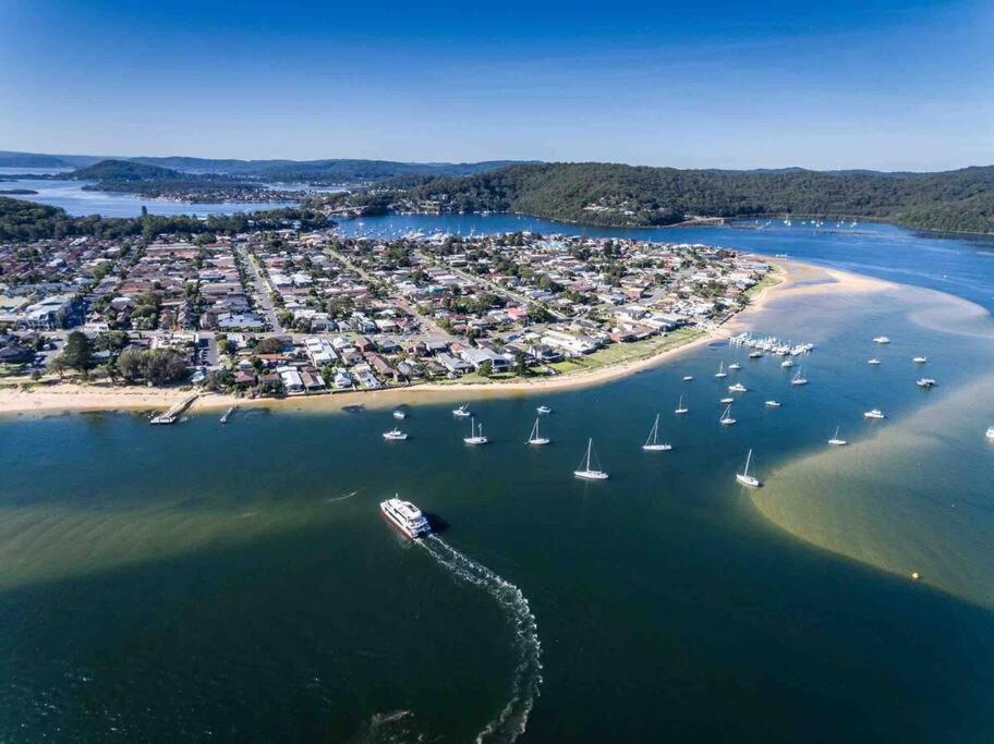 an aerial view of a beach with boats in the water at Booker Bay Ocean View in Booker Bay