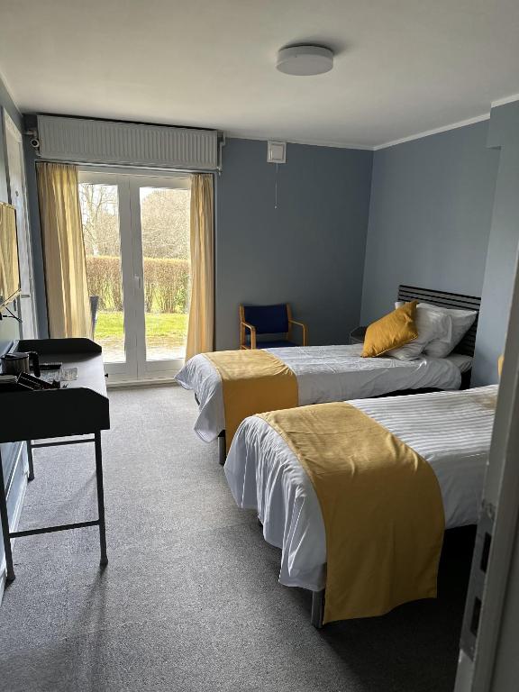 Postel nebo postele na pokoji v ubytování Lynge kro & Hotel