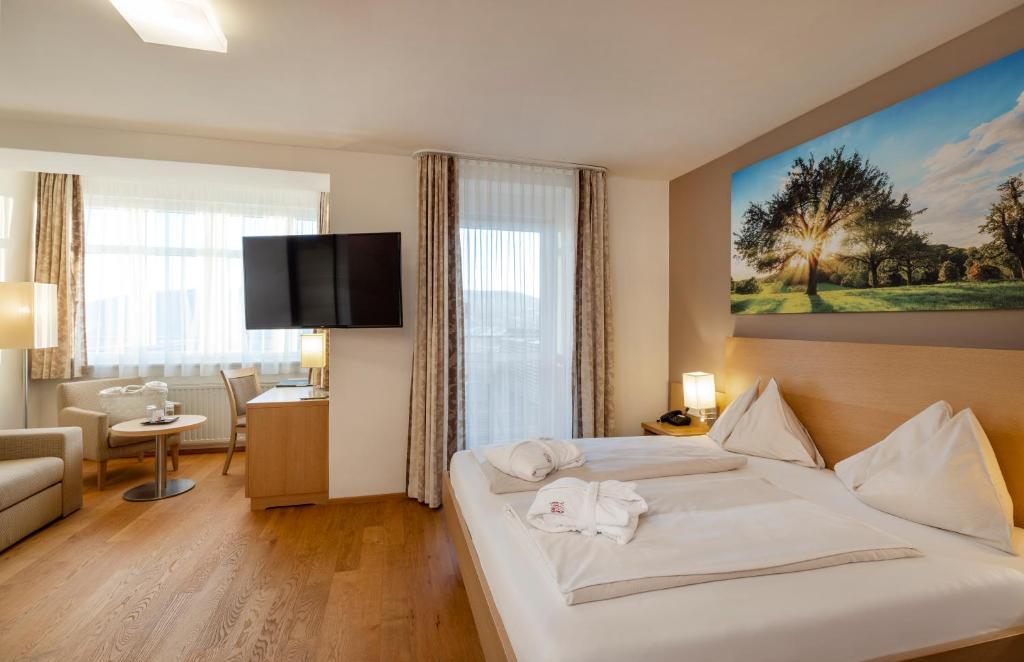 Postel nebo postele na pokoji v ubytování Vital-Hotel-Styria