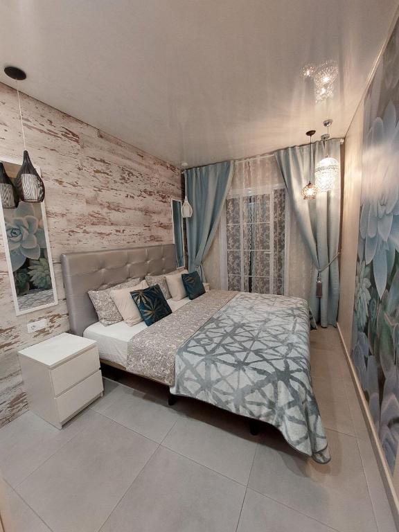 Posteľ alebo postele v izbe v ubytovaní ORLANDO LUXURY APARTAMENT