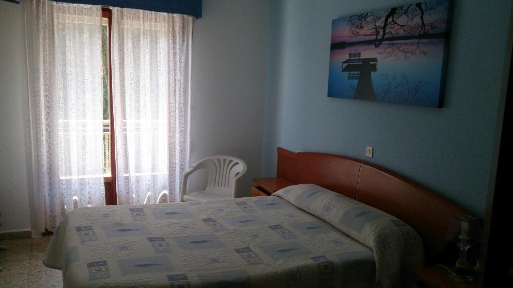 Posteľ alebo postele v izbe v ubytovaní Hotel Villa