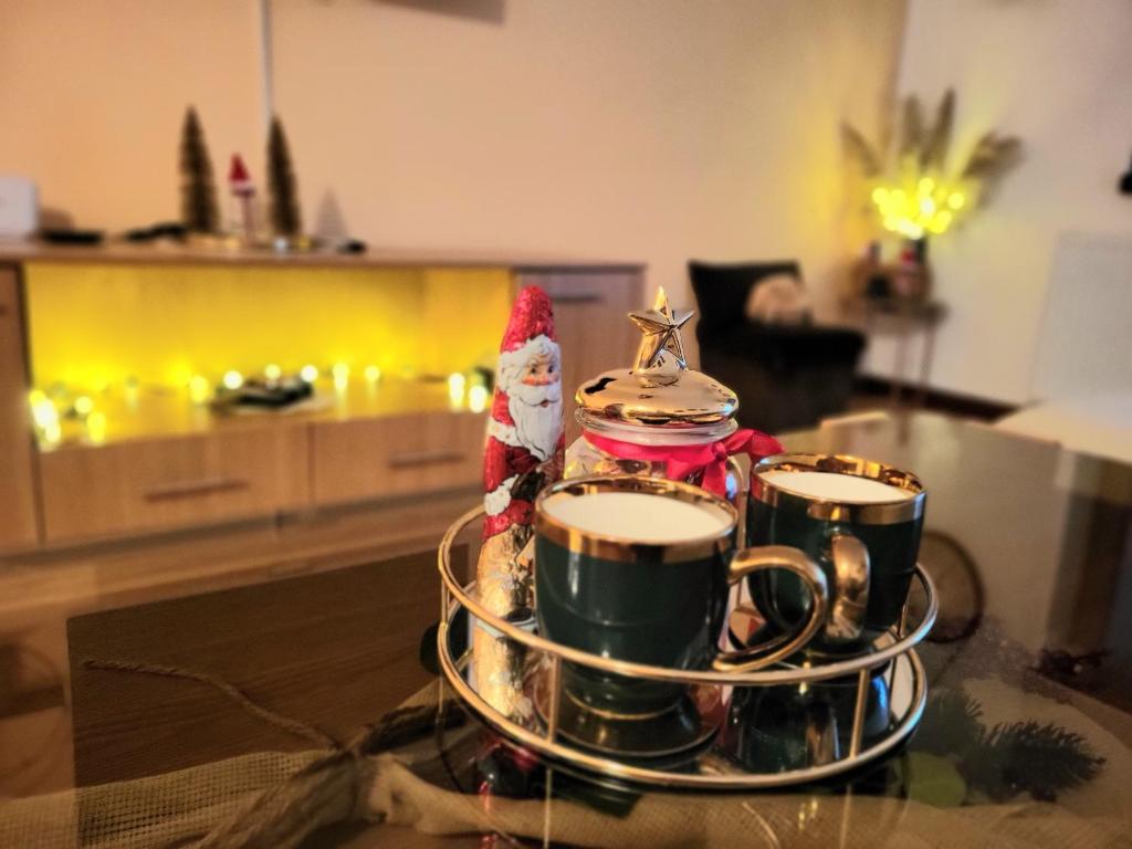 a set of three coffee cups sitting on a table at Eko FIS Snowscape in Šišava