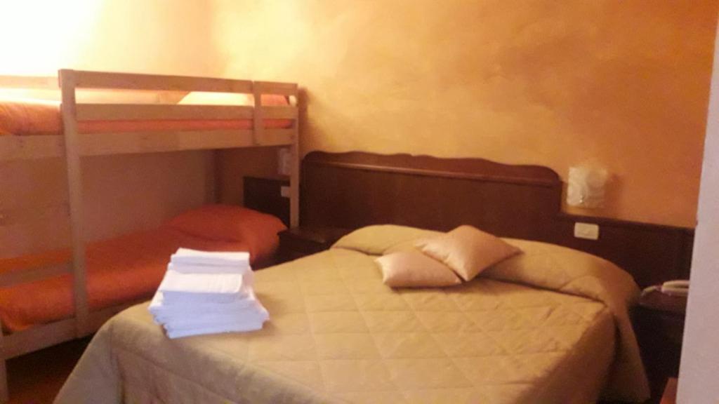 Postel nebo postele na pokoji v ubytování Hotel Natros