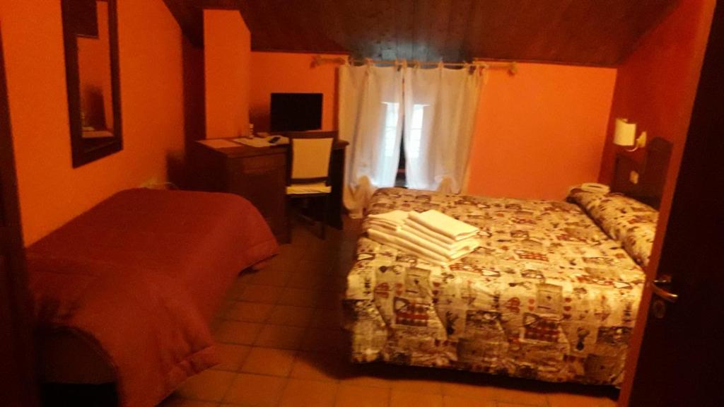 Postel nebo postele na pokoji v ubytování Hotel Natros