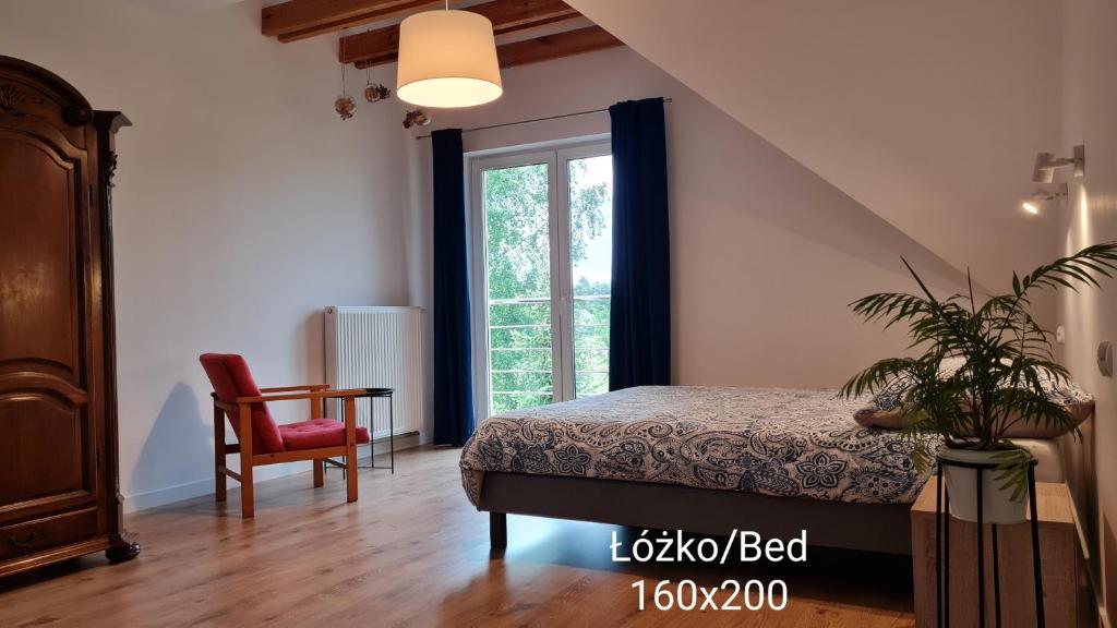 Posteľ alebo postele v izbe v ubytovaní Trasą S7 w 2h z Warszawy i Gdanska, Jadamowo holidaymazury, jacuzzi, jezioro