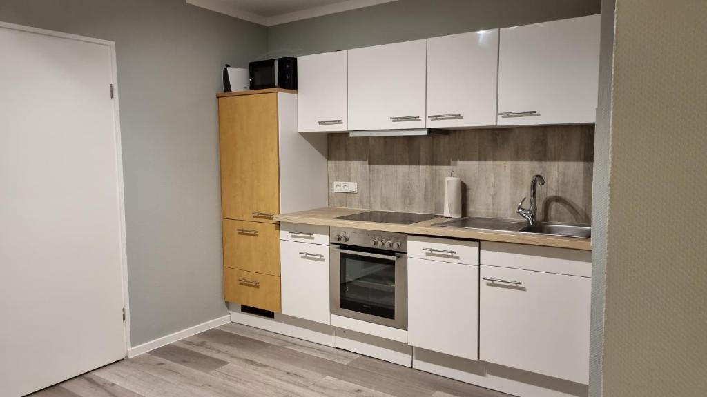 Kuchyň nebo kuchyňský kout v ubytování Haus Spökenkieker Loppersum