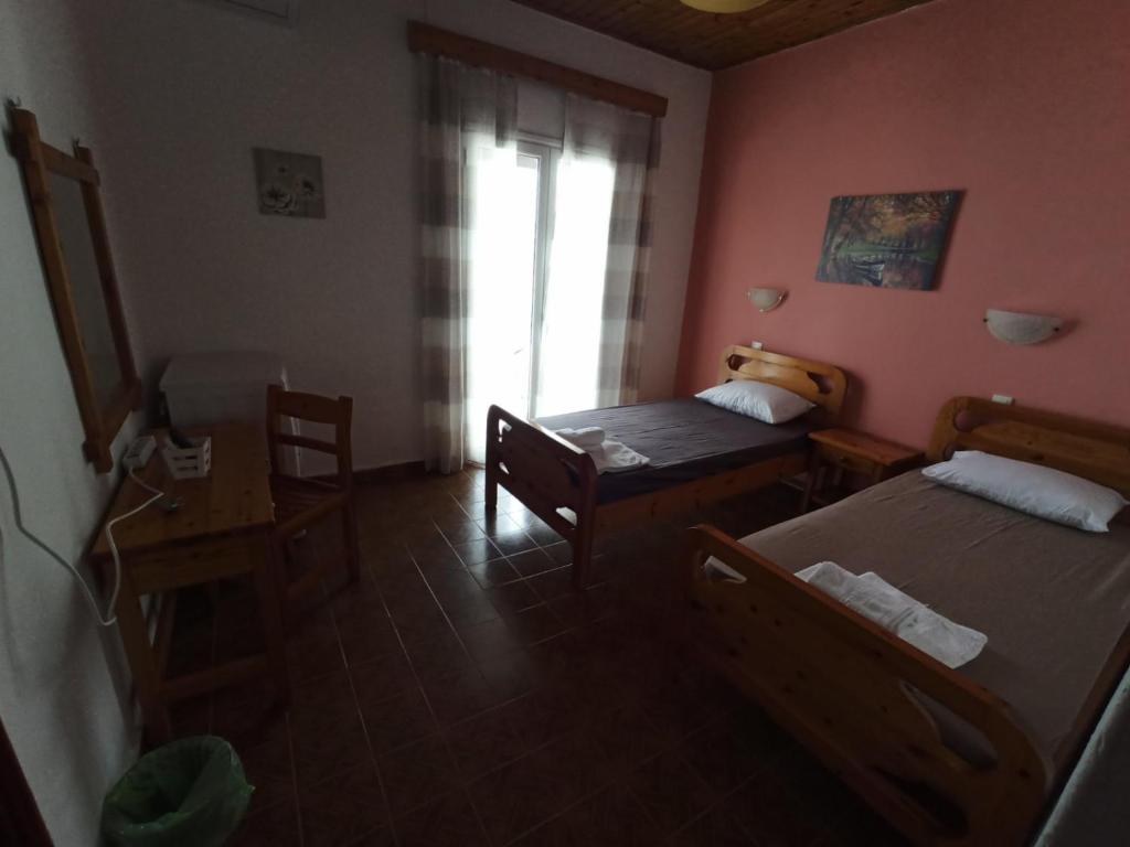 Posteľ alebo postele v izbe v ubytovaní Vila. Dionysos