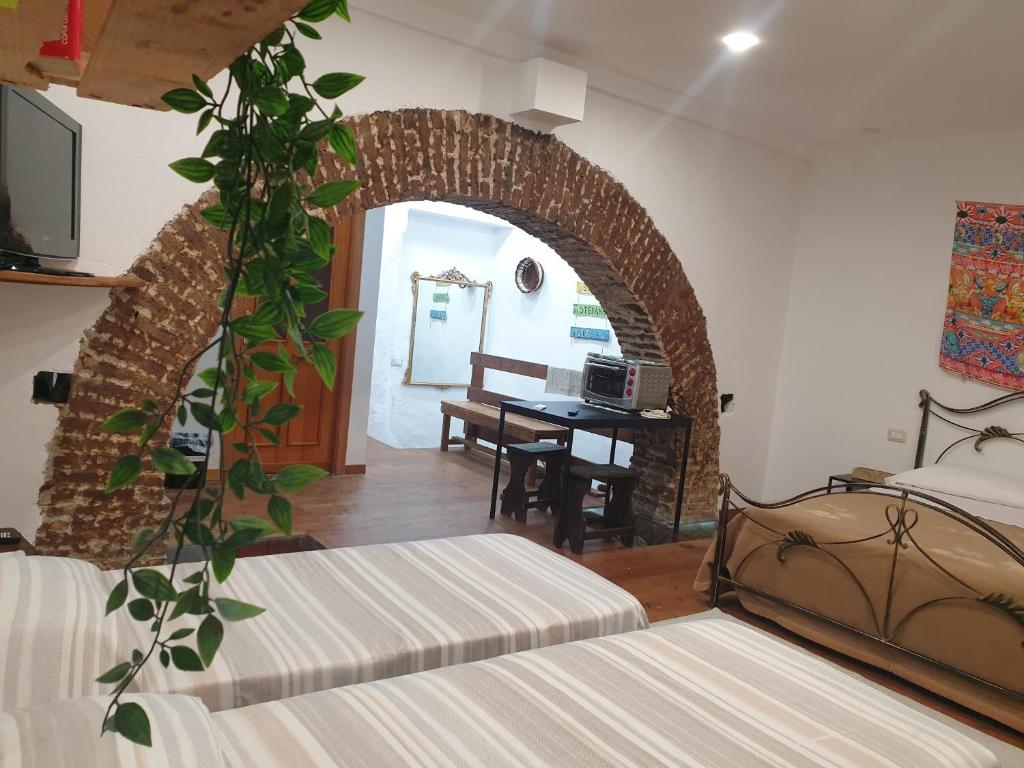 A bed or beds in a room at Sicily House Soprano
