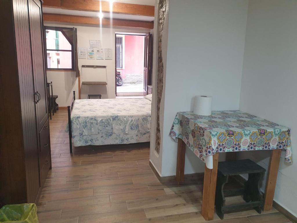 A bed or beds in a room at Sicily House Soprano