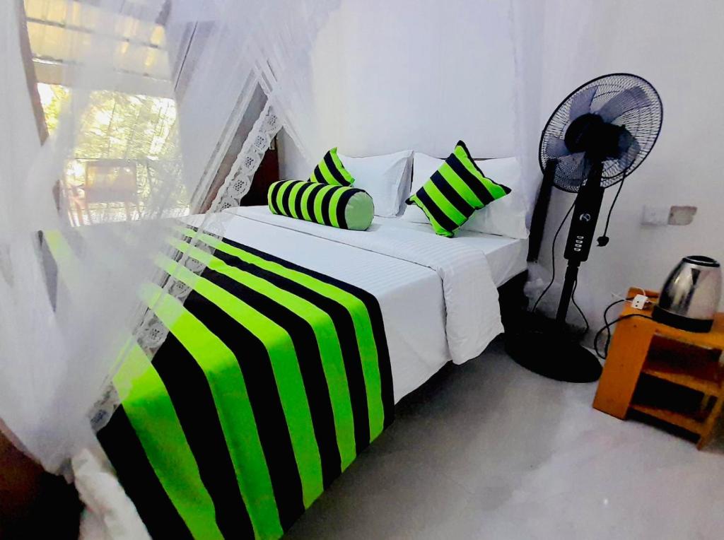 En eller flere senge i et værelse på Ella South Star