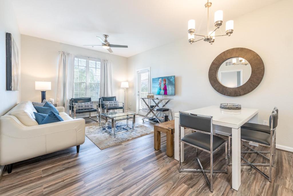 a living room with a couch and a table at VistaCay Balcony near Pool Convention Ctr iDrive in Orlando