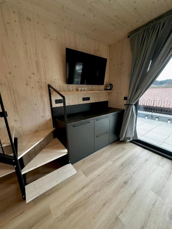 TV a/nebo společenská místnost v ubytování Penzion a Restaurace Pod Sjezdovkou