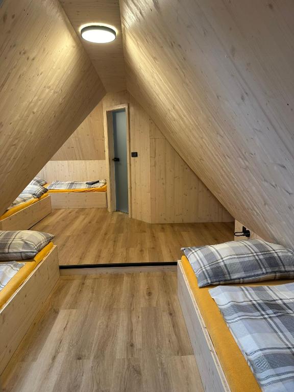 Postel nebo postele na pokoji v ubytování Penzion a Restaurace Pod Sjezdovkou