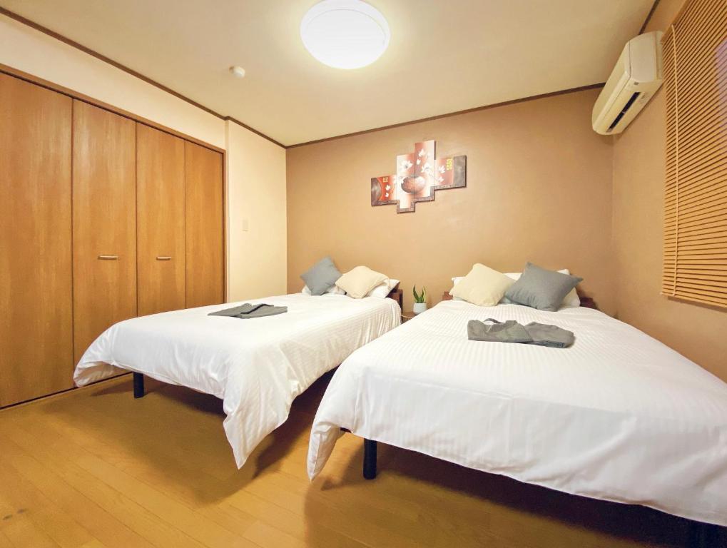 Un pat sau paturi într-o cameră la Sakuraya Ryokan - Vacation STAY 51125v