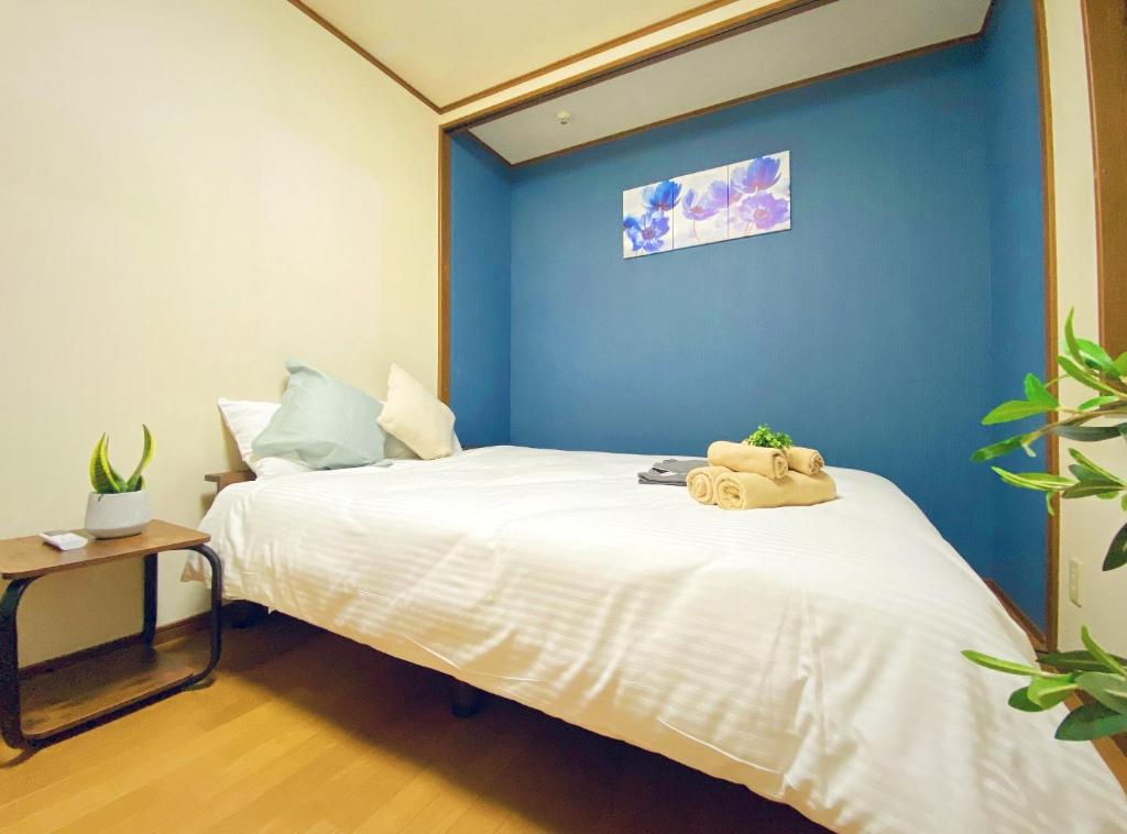 מיטה או מיטות בחדר ב-Sakuraya Ryokan - Vacation STAY 51706v