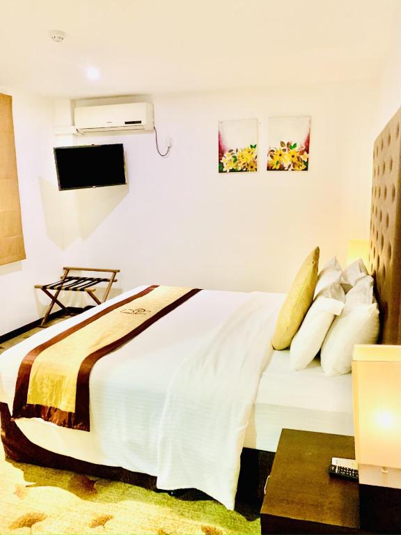 Postel nebo postele na pokoji v ubytování City Hotel Colombo 02