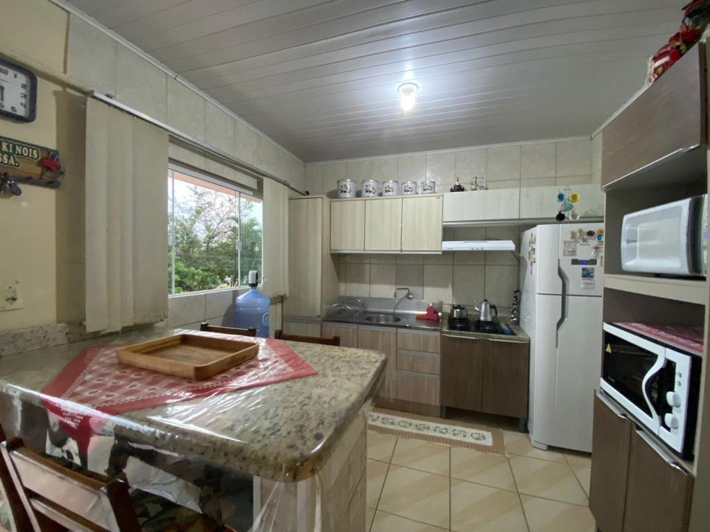 Dapur atau dapur kecil di Casa aconchegante