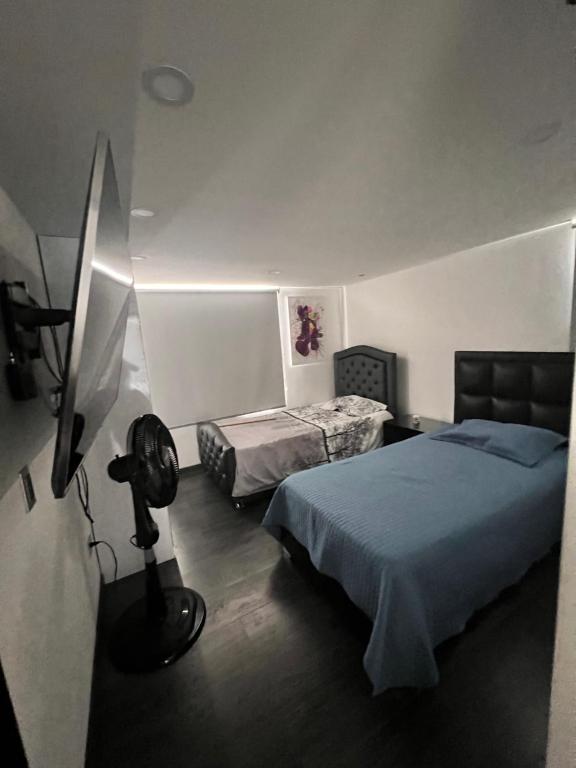 Postel nebo postele na pokoji v ubytování Casa vacacional en Pereira