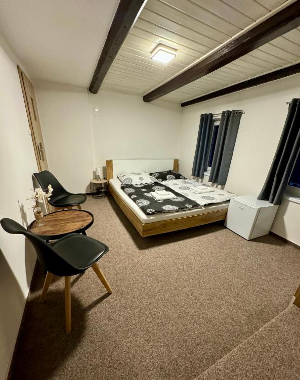 Postel nebo postele na pokoji v ubytování Jizerské apartmány Ha&Ha
