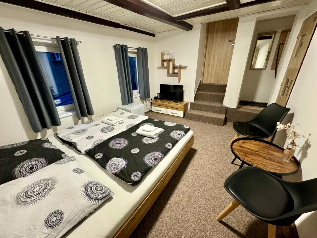 Postel nebo postele na pokoji v ubytování Jizerské apartmány Ha&Ha