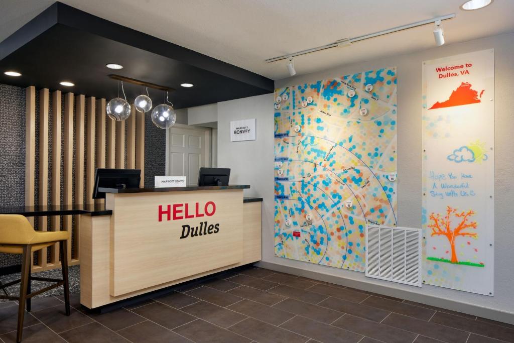 an office with a hello dills sign on the wall at TownePlace Suites Dulles Airport in Sterling