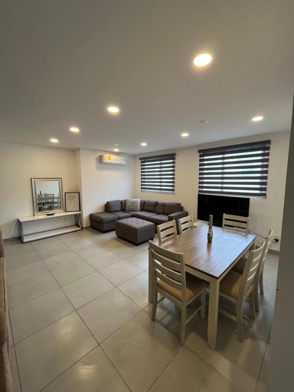 a living room with a table and a couch at Apartment in Tijuana in Tijuana