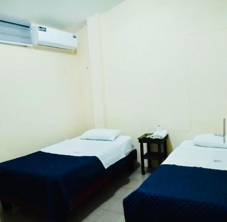 Postel nebo postele na pokoji v ubytování Veranera Hostal