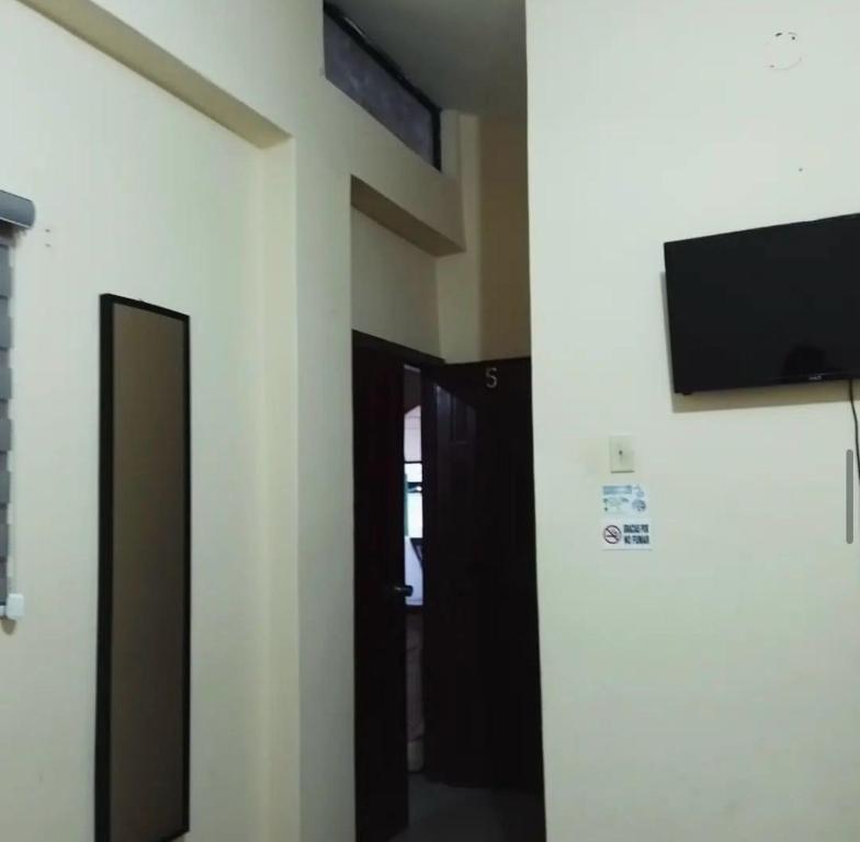 TV a/nebo společenská místnost v ubytování Veranera Hostal