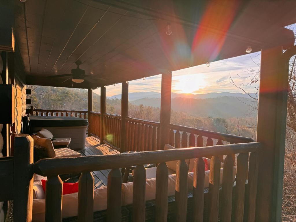 a balcony with a view of the mountains at Smoky Paws - Exceptional Cabin, Stunning Mountain Views, Hot Tub, Tranquil, Gigabit Internet, Free L2 EV in Pigeon Forge