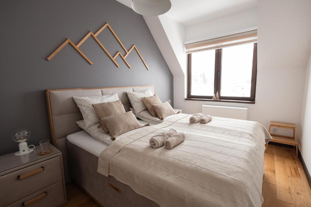 Postel nebo postele na pokoji v ubytování Glečer Kop, Apartment A14, FREE Parking Garage