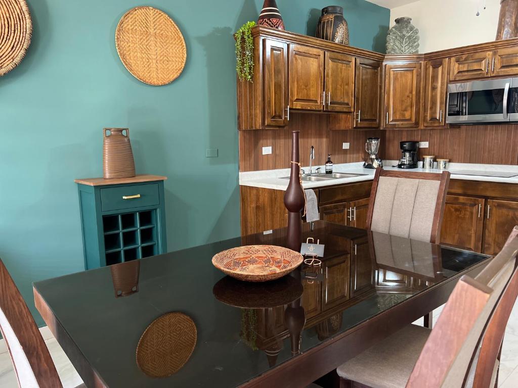 a kitchen with a table with a bowl on it at Urban Hotel El Ancla Suites - Apartment 3 in Puerto Peñasco