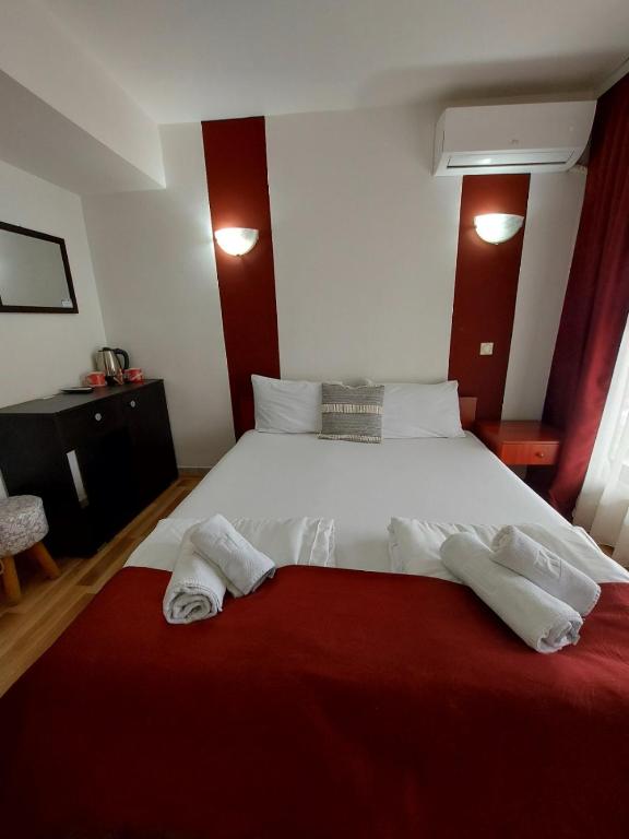 Postel nebo postele na pokoji v ubytování The Bulevard Hotel