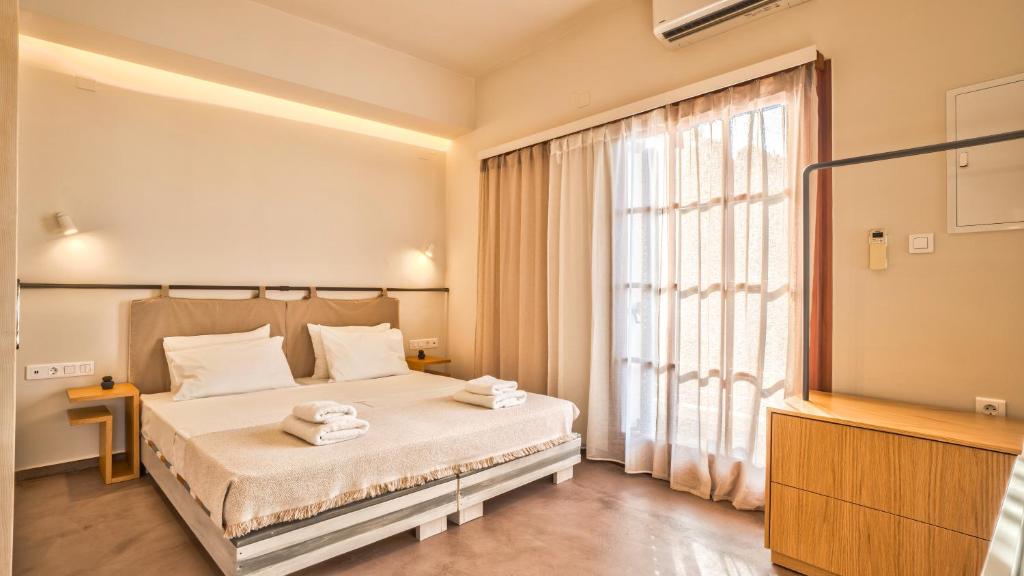 Posteľ alebo postele v izbe v ubytovaní Avra Apartments