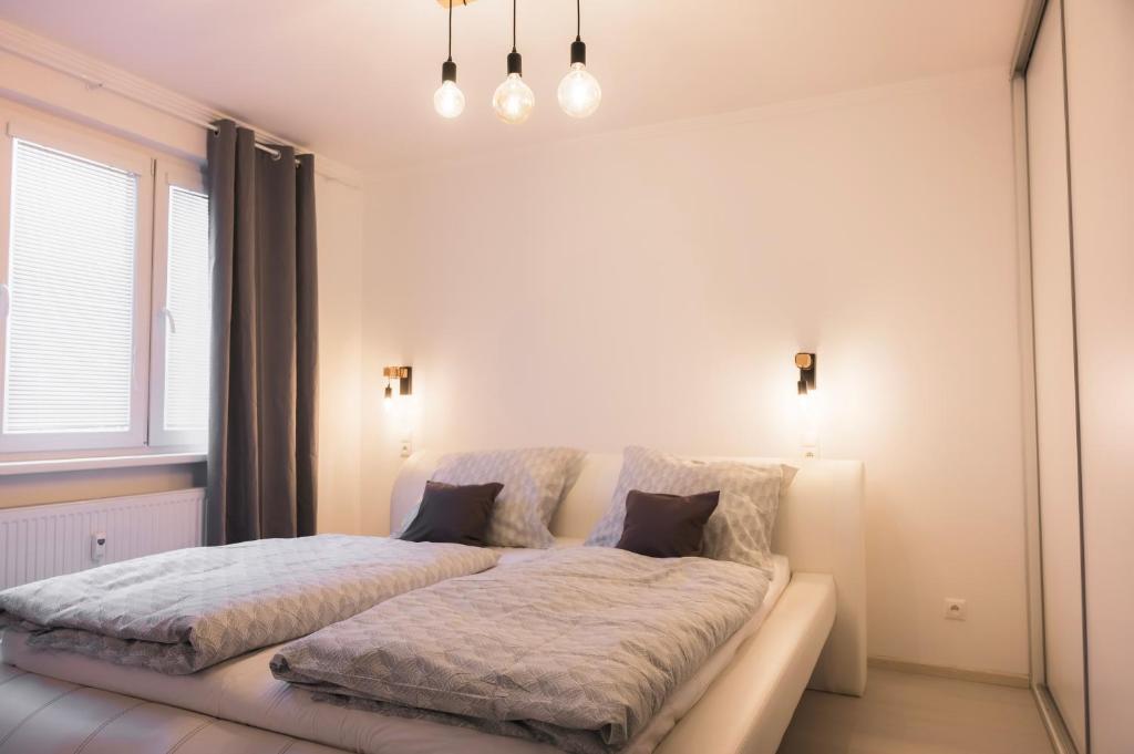 Postel nebo postele na pokoji v ubytování Apartmán Štefánik #1