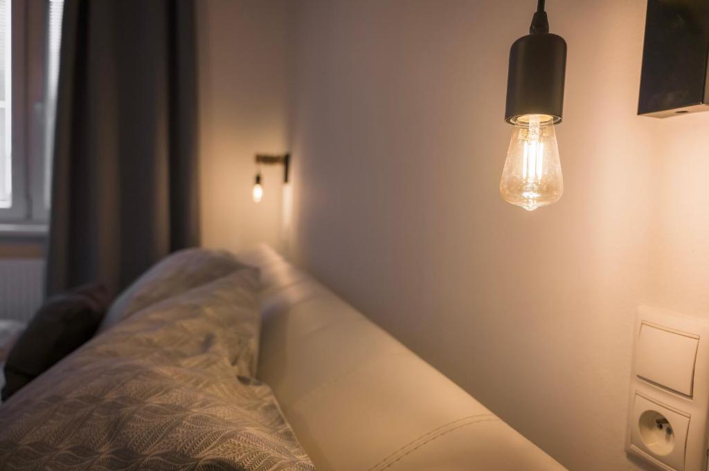 Postel nebo postele na pokoji v ubytování Apartmán Štefánik #1