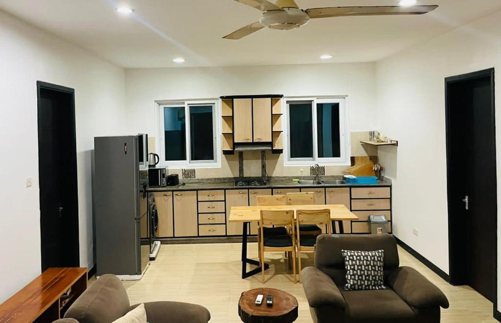 a kitchen with a table and a dining room at Jwapano housing in Dar es Salaam