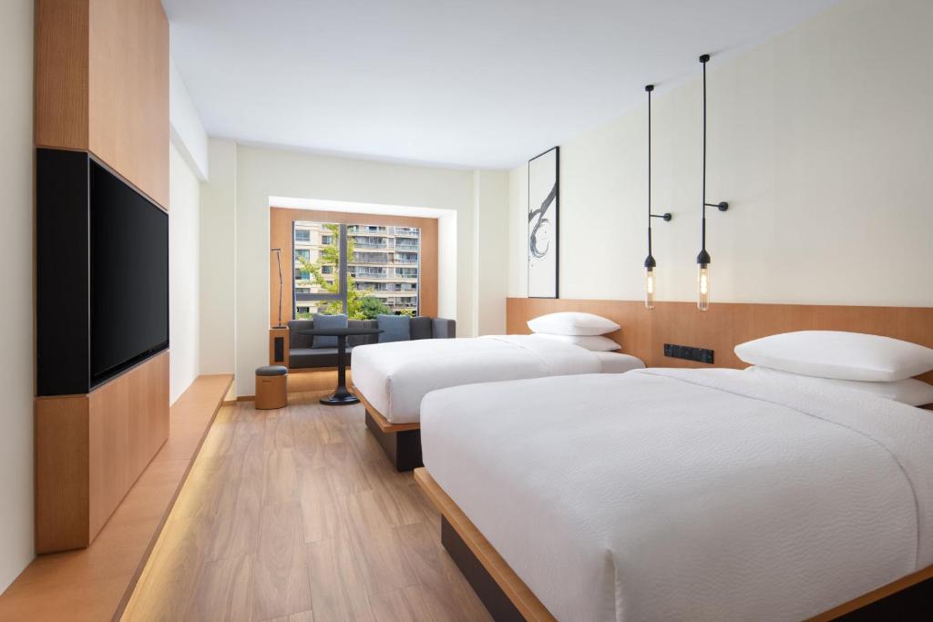 Postel nebo postele na pokoji v ubytování Fairfield by Marriott Zhuji