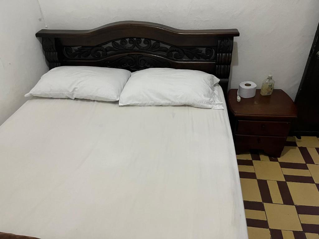 Postel nebo postele na pokoji v ubytování Casa Grande Hostal