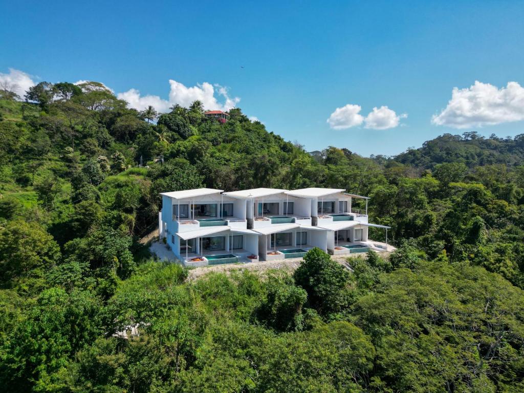 an aerial view of a house in the forest at Les Roches - Paradise Retreat in Santa Teresa Beach