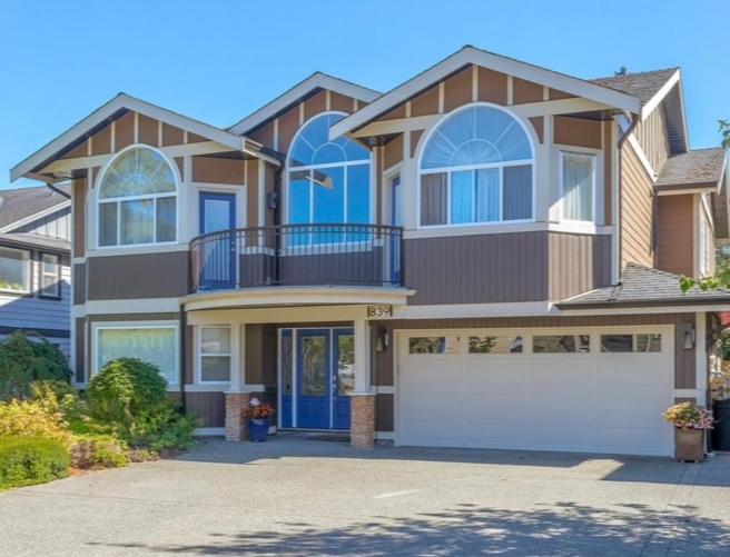 a large house with a white garage at Angel 3D in Victoria